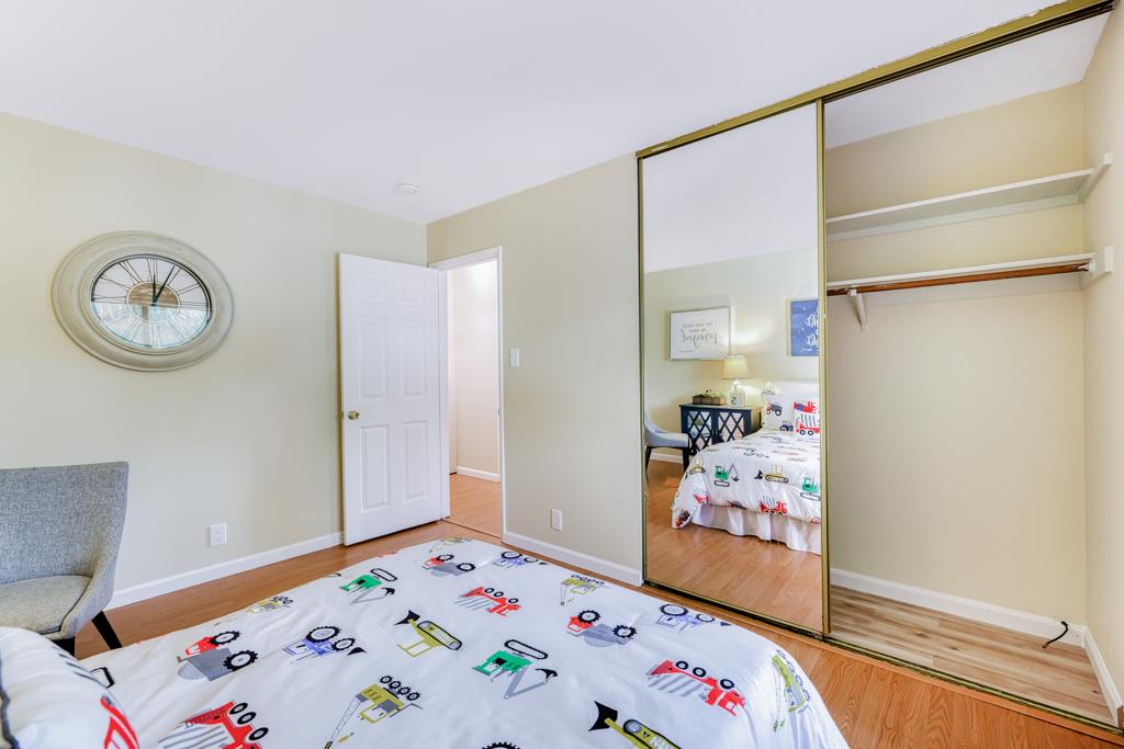 38455 Bronson Street, Unit 322 Fremont, CA 94536 - Photo 25 of 35 a bedroom with a bed and a window