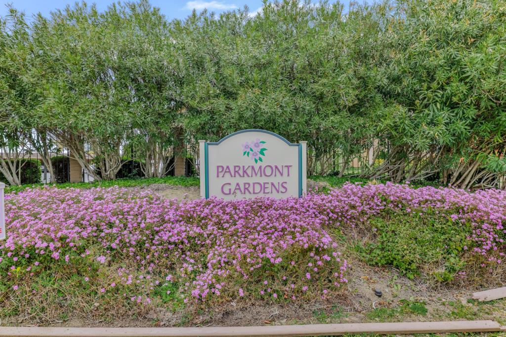 38455 Bronson Street, Unit 322 Fremont, CA 94536 - Photo 27 of 35 a sign that is sitting in front of flowers