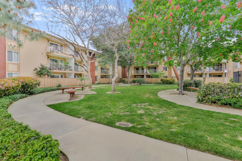 38455 Bronson Street, Unit 322 Fremont, CA 94536 - Photo 30 of 35 a view of a building with a yard