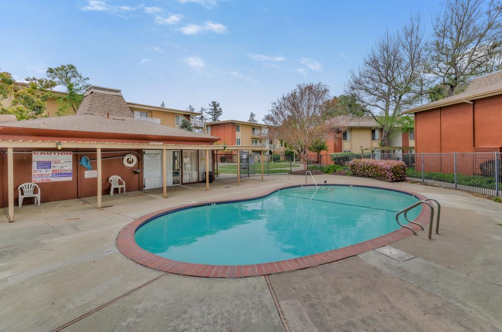 38455 Bronson Street, Unit 322 Fremont, CA 94536 - Photo 34 of 35 a view of a house with swimming pool and sitting area