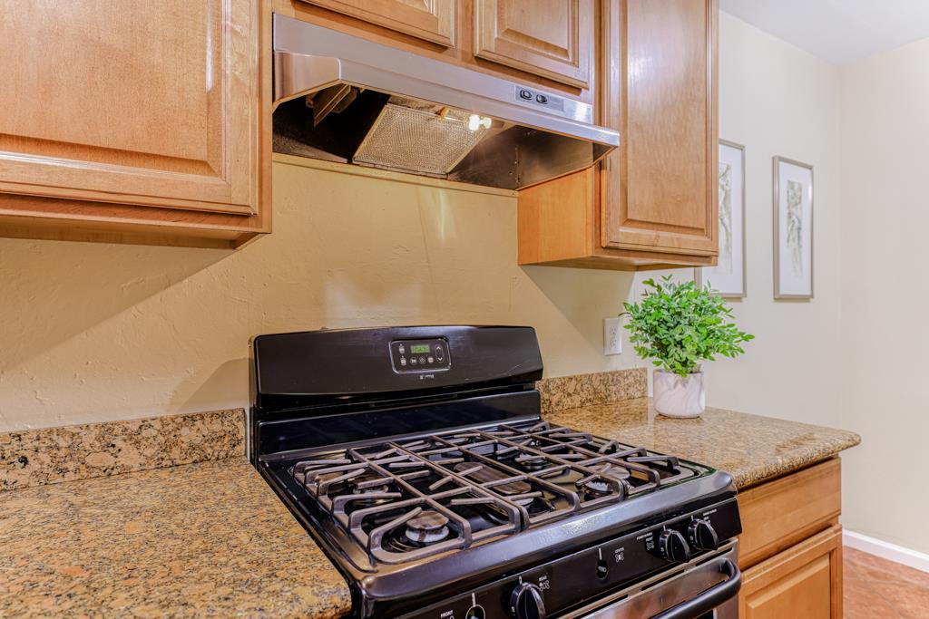 38455 Bronson Street, Unit 322 Fremont, CA 94536 - Photo 10 of 35 a stove top oven sitting inside of a kitchen
