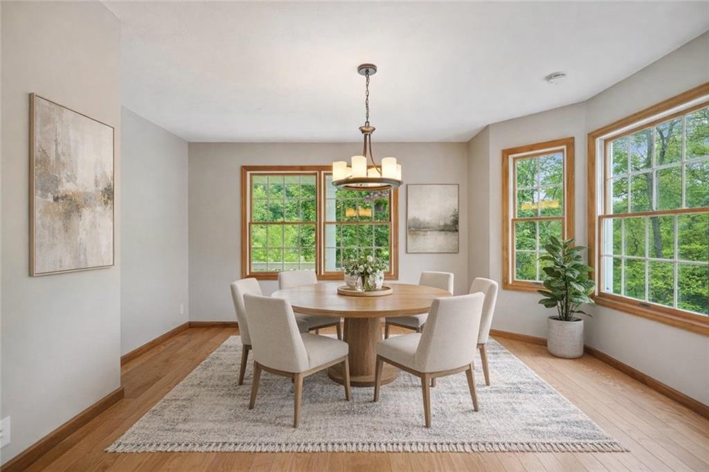 565 Leeper Road Georgetown, PA 15043 - Photo 11 of 46 a dining room with furniture a chandelier and wooden floor