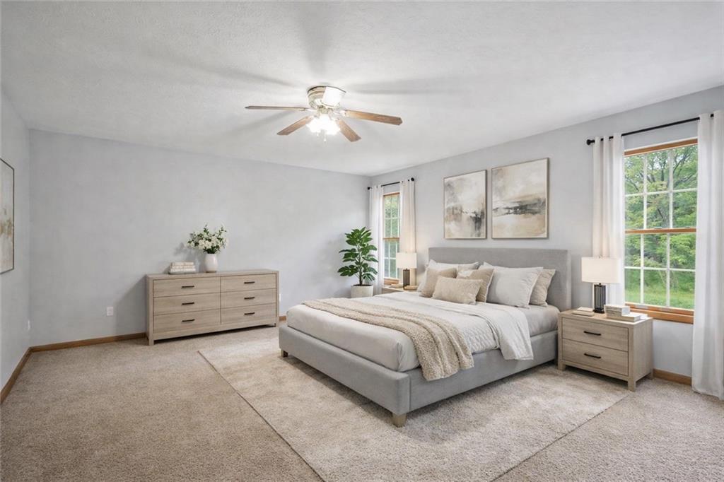 565 Leeper Road Georgetown, PA 15043 - Photo 17 of 46 a bedroom with a bed and a large window