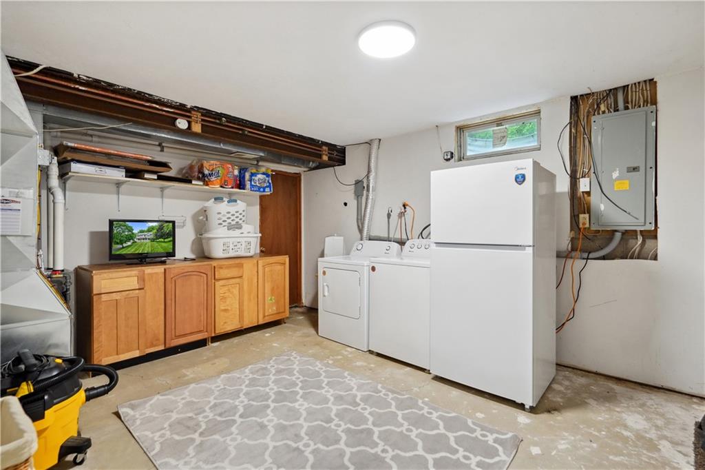 565 Leeper Road Georgetown, PA 15043 - Photo 32 of 46 a utility room with cabinets washer and dryer