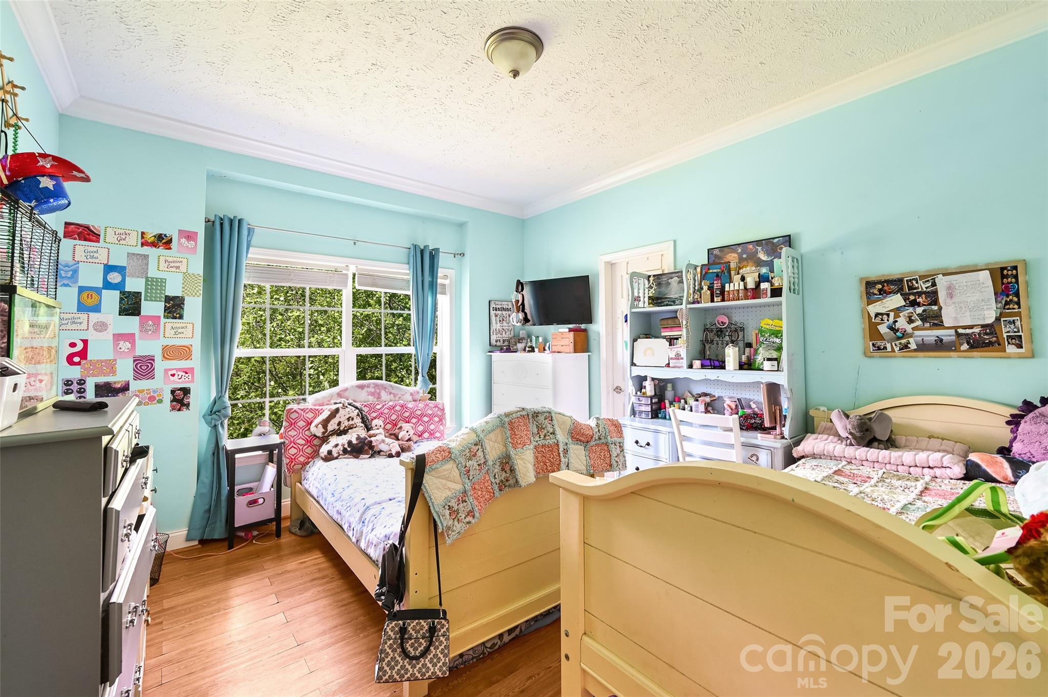 371 Starnes Cove Road Candler, NC 28715 - Photo 16 of 21 a bed room with a bed and a chair