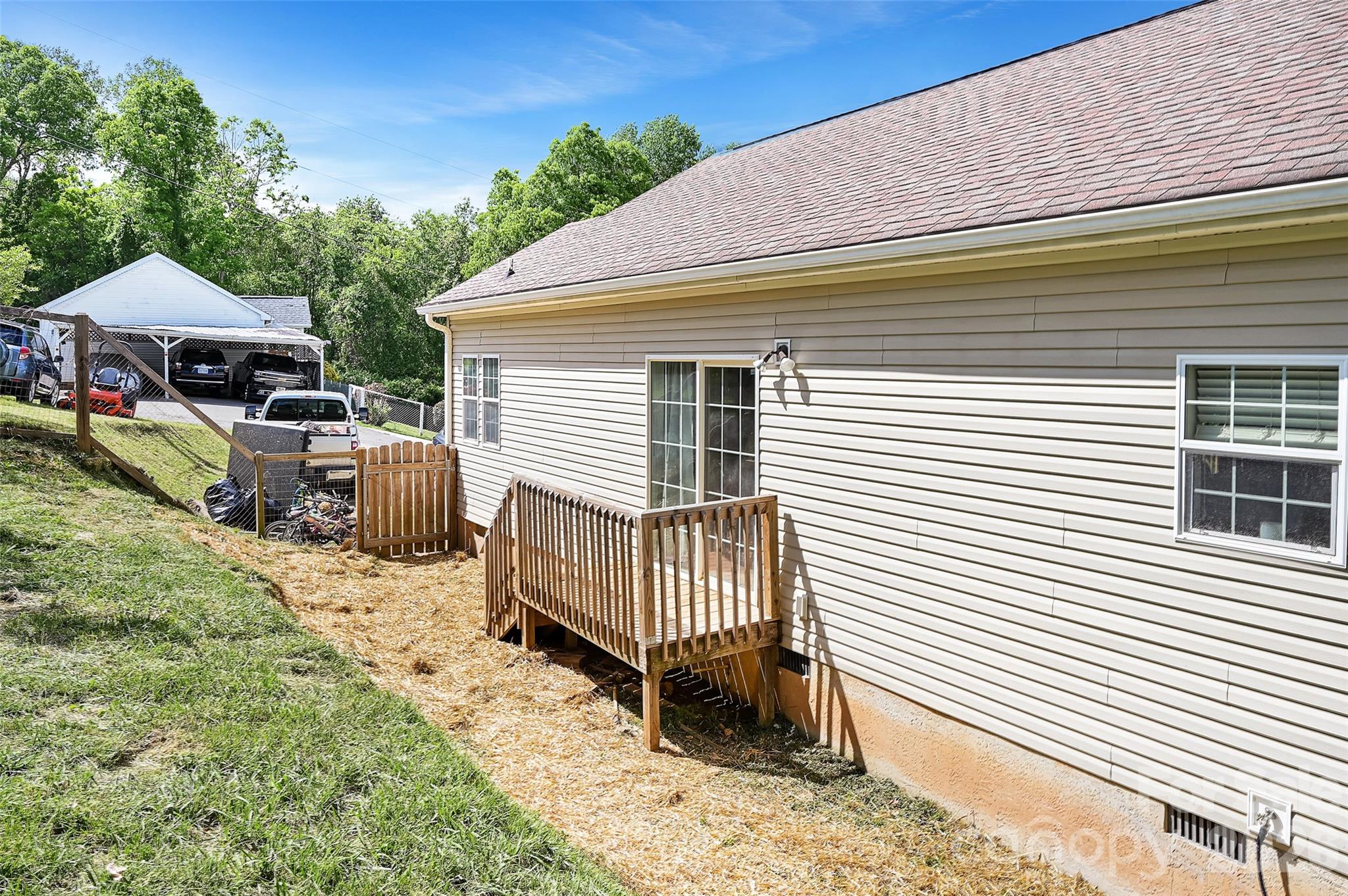 371 Starnes Cove Road Candler, NC 28715 - Photo 18 of 21 a view of a house with a yard and furniture