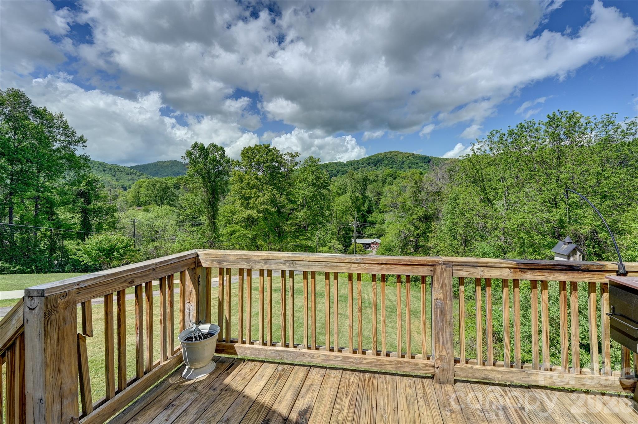371 Starnes Cove Road Candler, NC 28715 - Photo 20 of 21 a view of balcony with wooden floor and fence