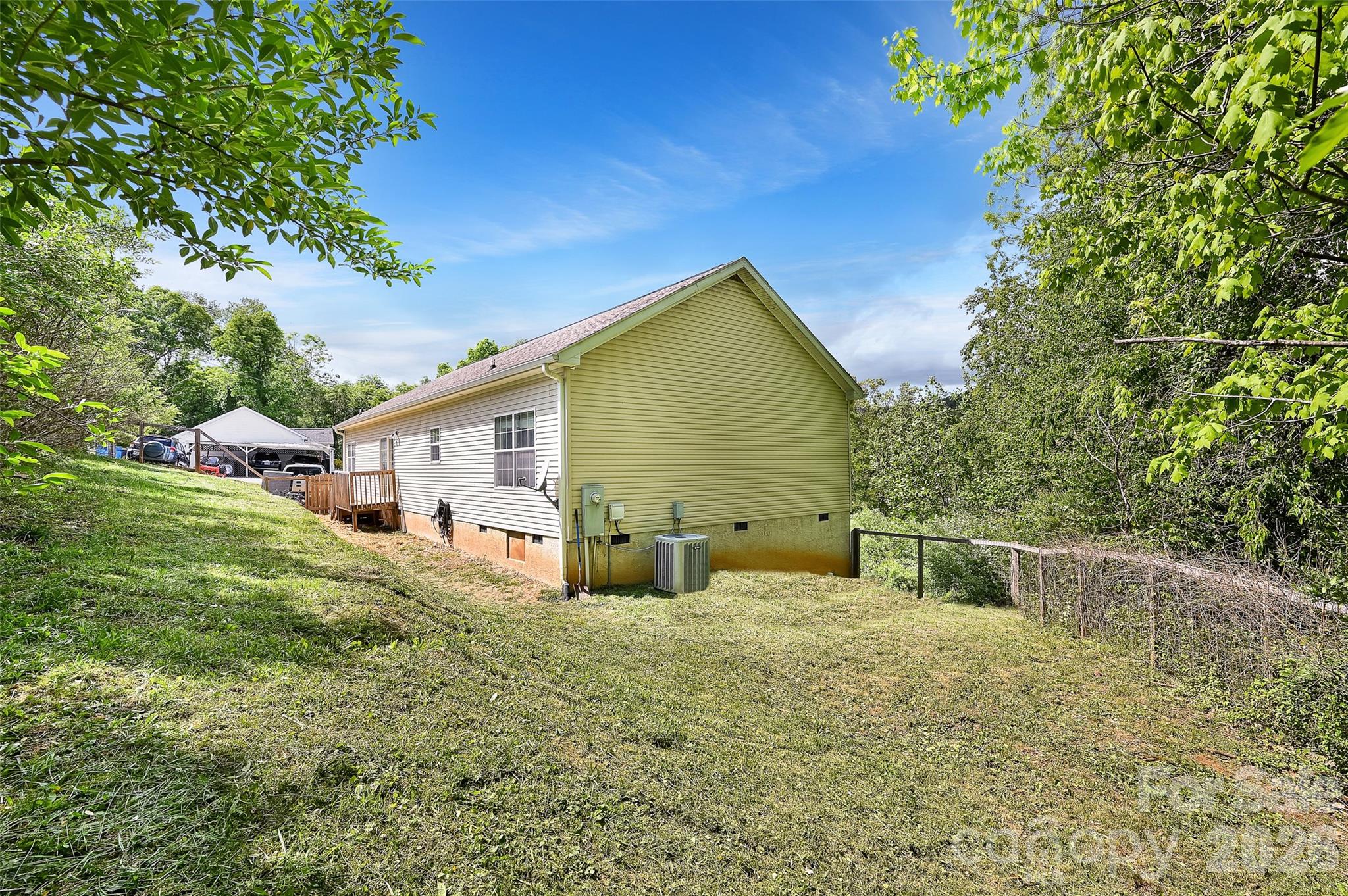 371 Starnes Cove Road Candler, NC 28715 - Photo 21 of 21 a front view of a house with garden