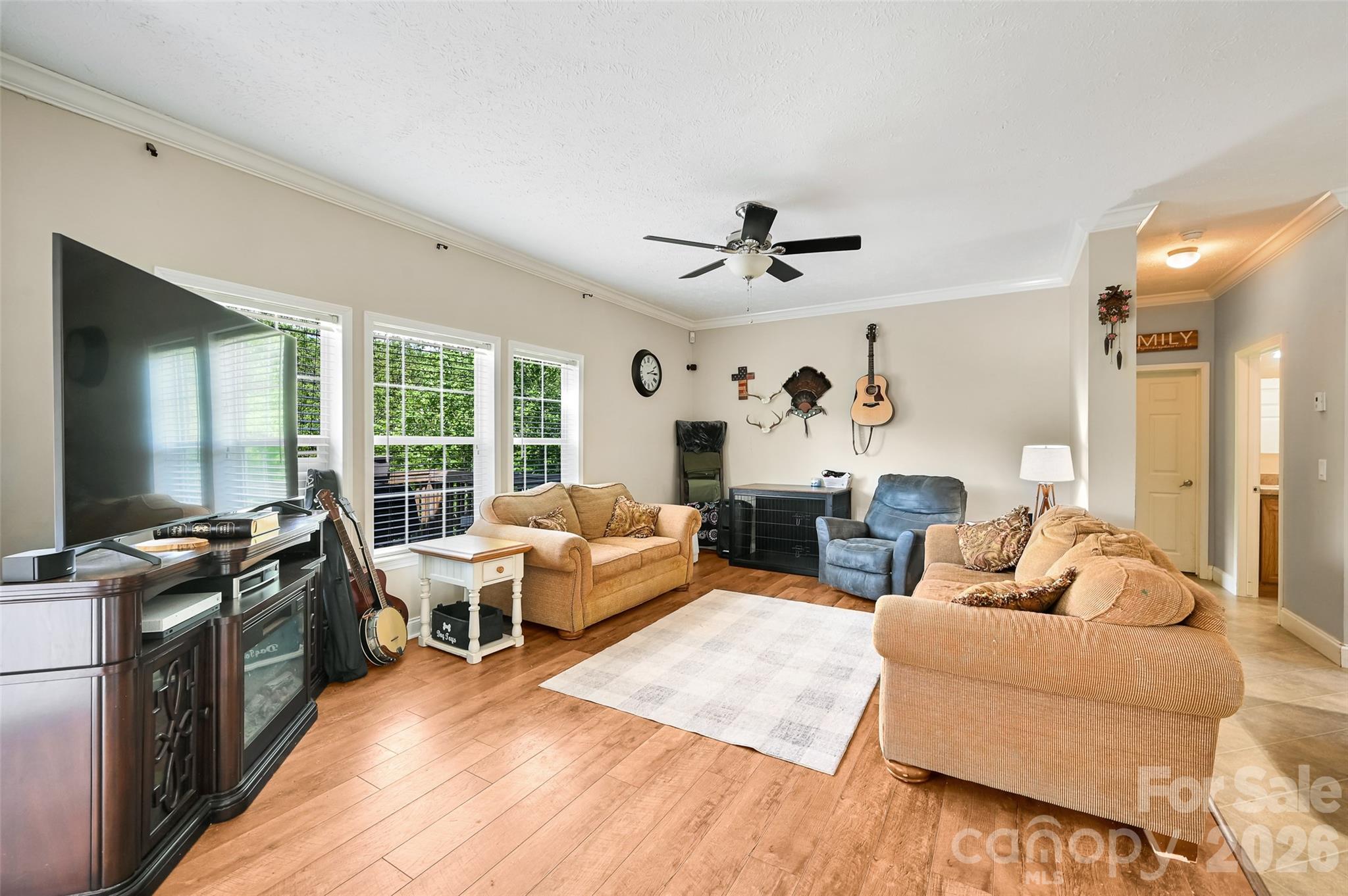 371 Starnes Cove Road Candler, NC 28715 - Photo 4 of 21 a living room with furniture fireplace and a large window