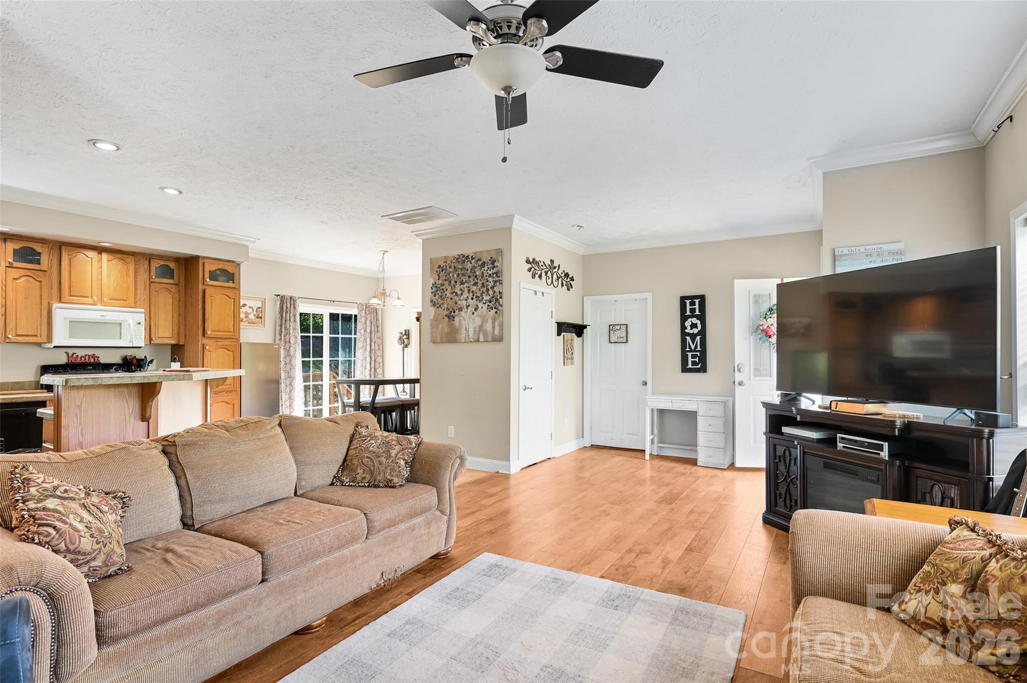 371 Starnes Cove Road Candler, NC 28715 - Photo 5 of 21 a living room with furniture and a flat screen tv