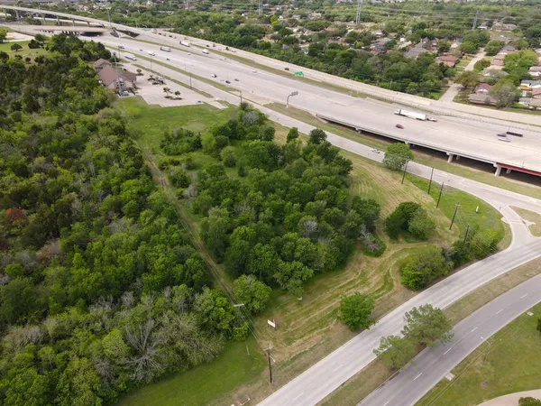 a view of a balcony with a yard