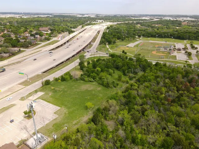 a view of a lake with a yard