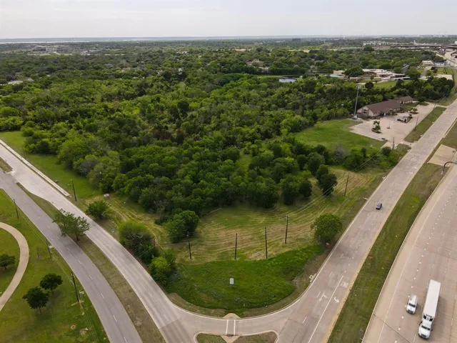 a view of a yard from a balcony