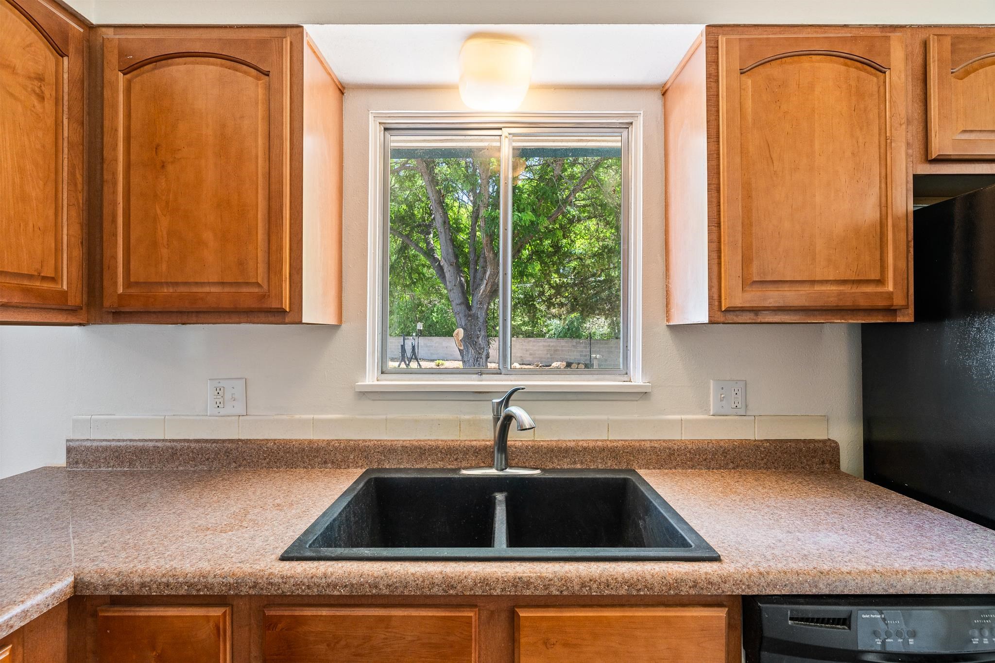 552 Normandy Drive Grand Junction, CO 81501 - Photo 11 of 23 a kitchen with granite countertop a sink and a stove