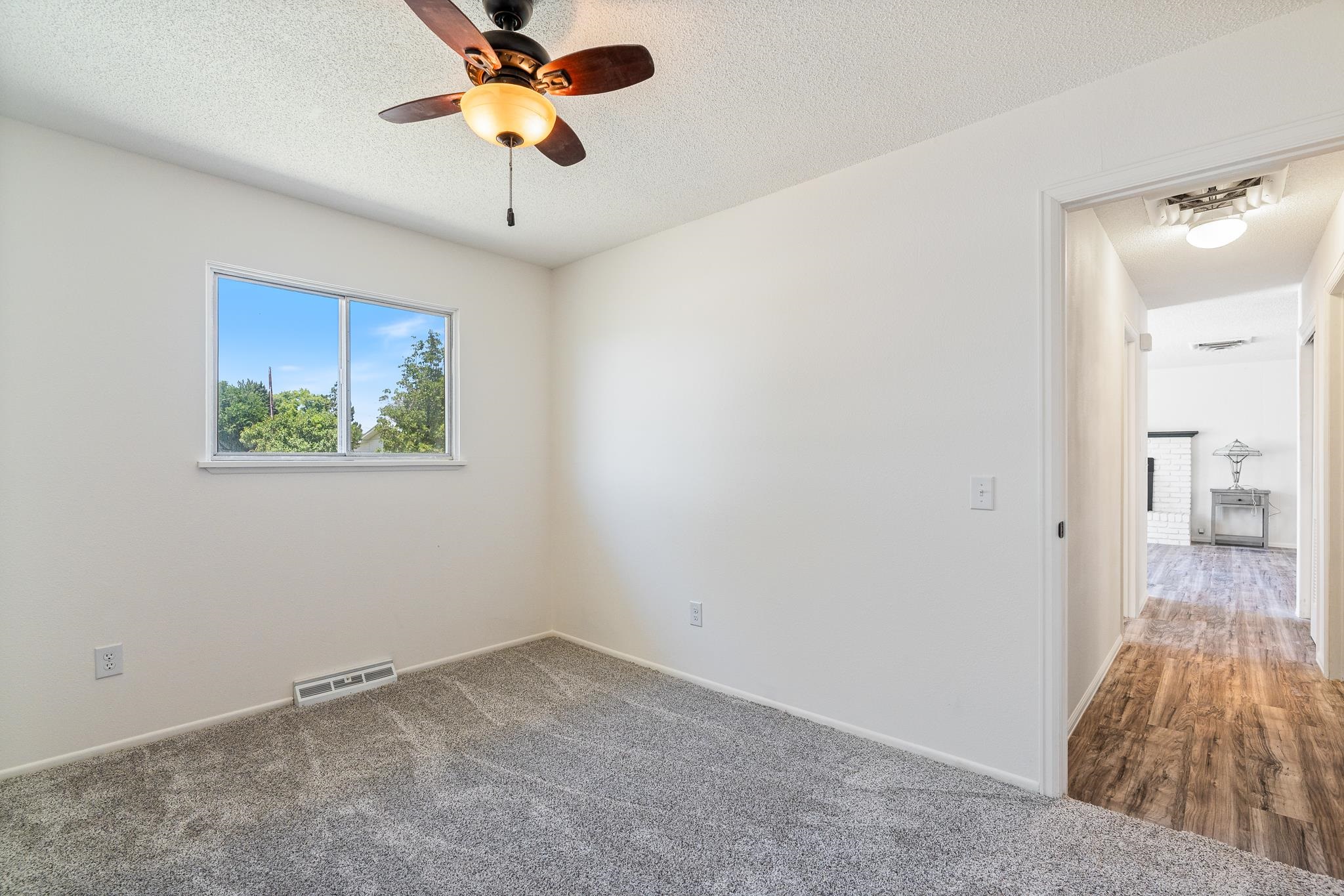 552 Normandy Drive Grand Junction, CO 81501 - Photo 17 of 23 a view of empty room with a ceiling fan