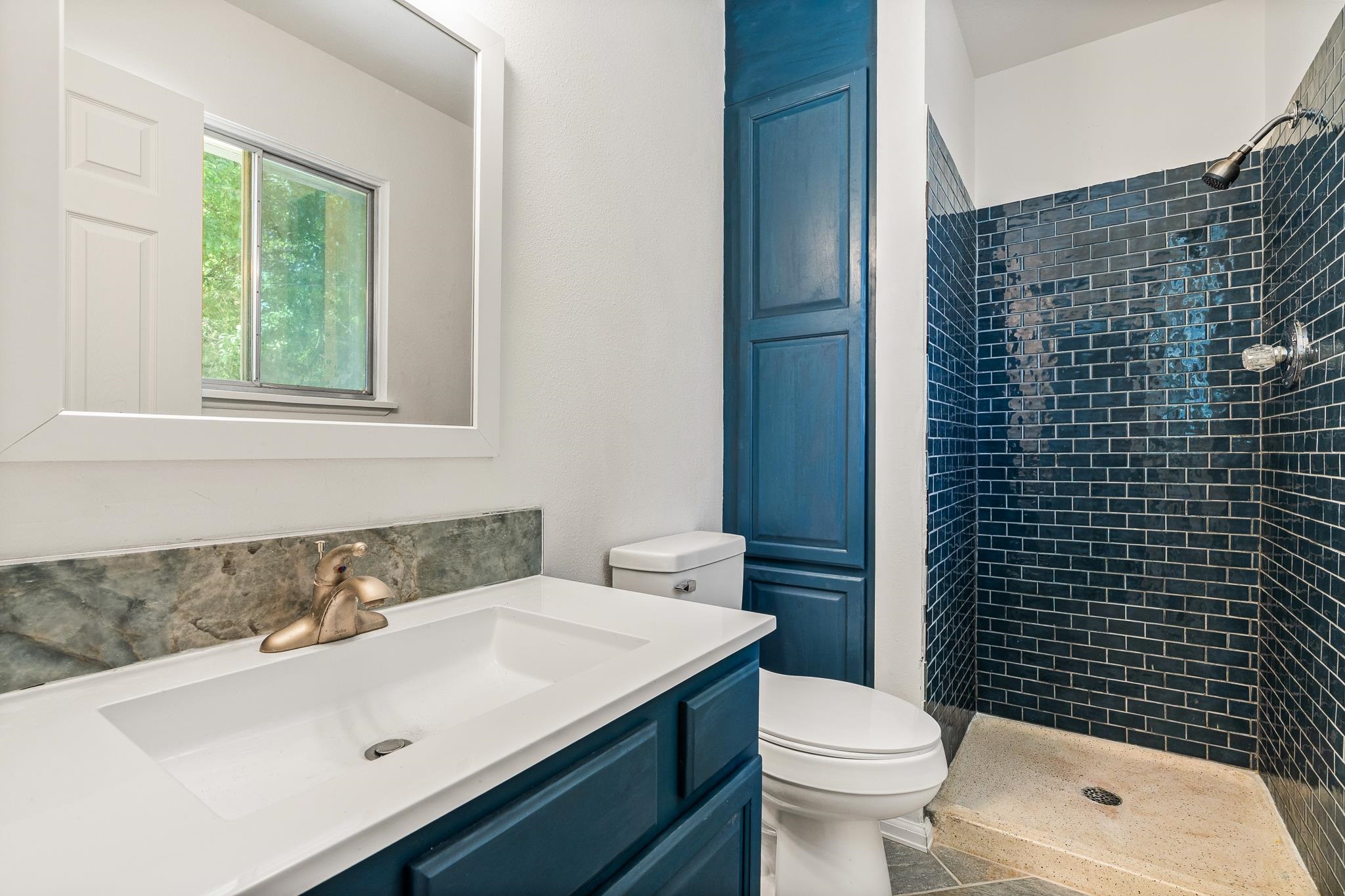 552 Normandy Drive Grand Junction, CO 81501 - Photo 18 of 23 a bathroom with a sink a toilet and shower