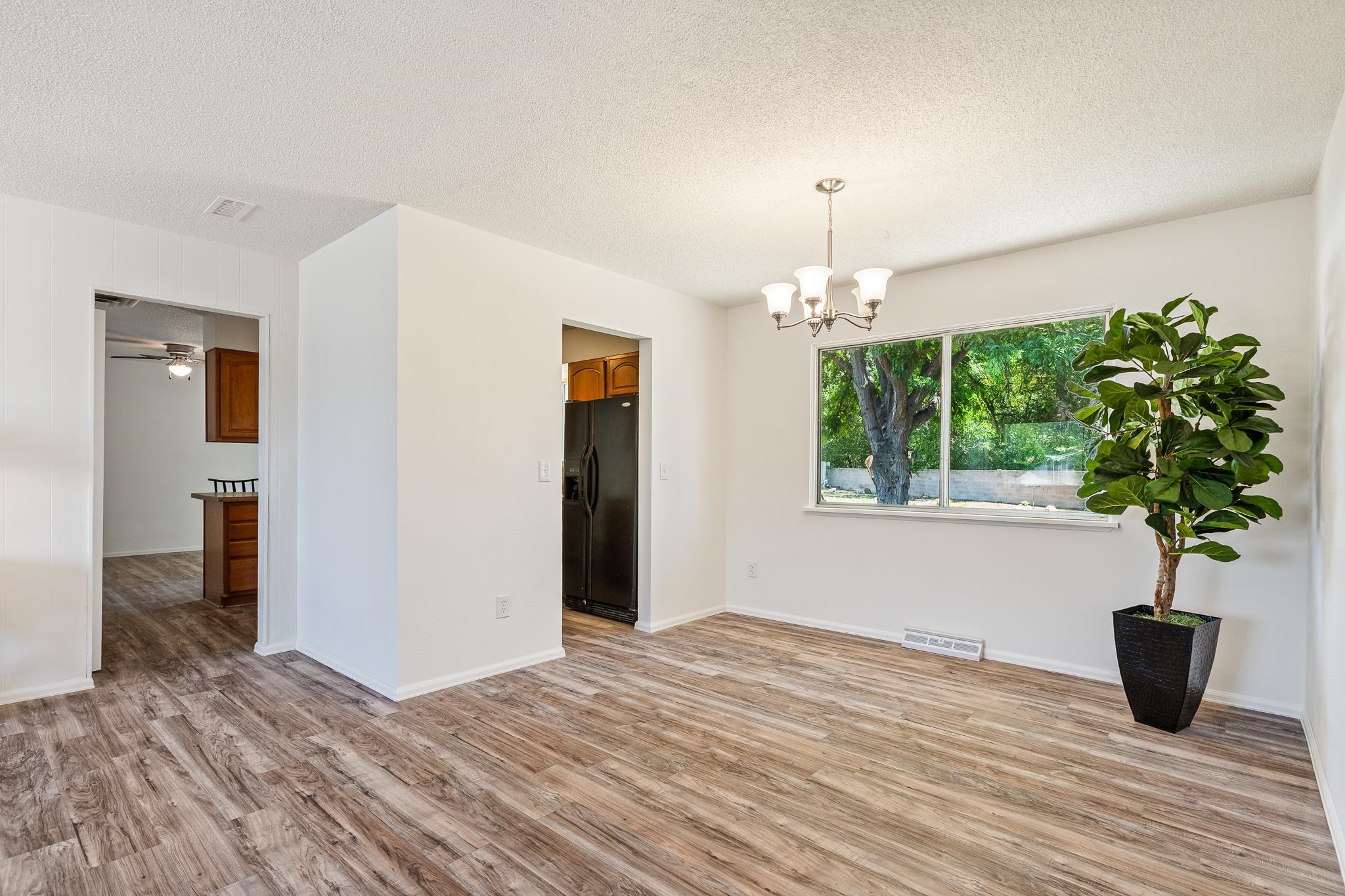 552 Normandy Drive Grand Junction, CO 81501 - Photo 5 of 23 a window in an empty room with wooden floor