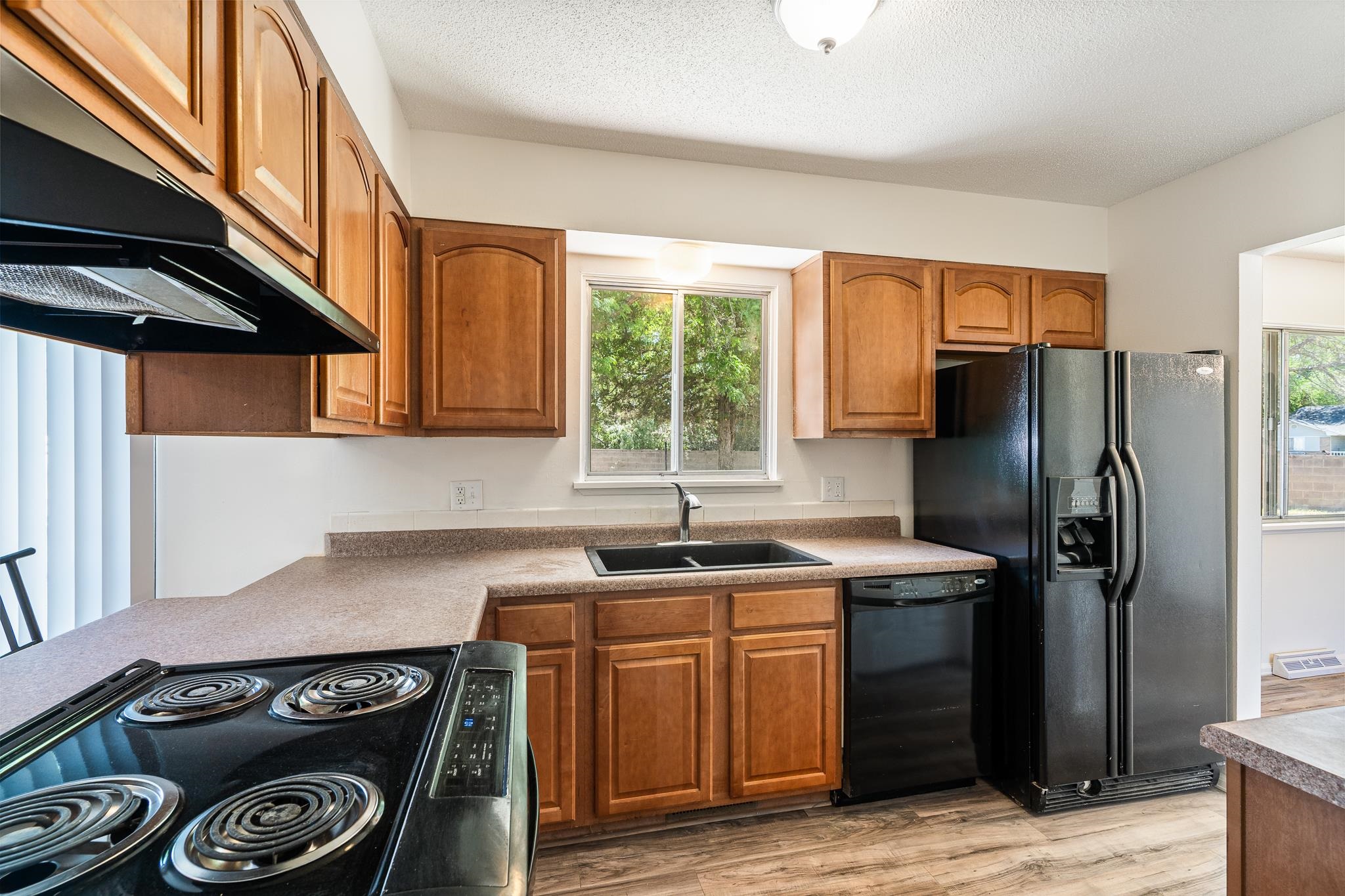 552 Normandy Drive Grand Junction, CO 81501 - Photo 9 of 23 a kitchen with a sink a refrigerator and a stove