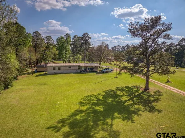 a view of a lake with a building in the background