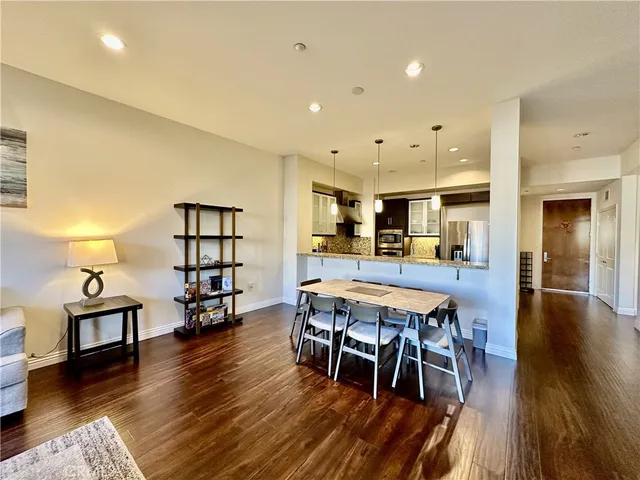 a view of a dining room with furniture and wooden floor