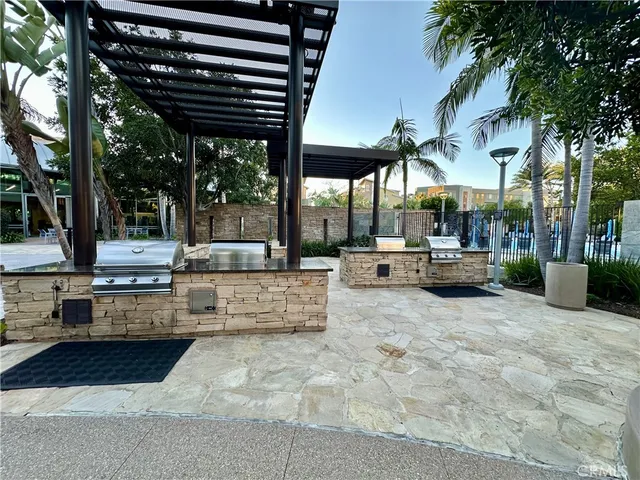 a view of a patio with swimming pool table and chairs