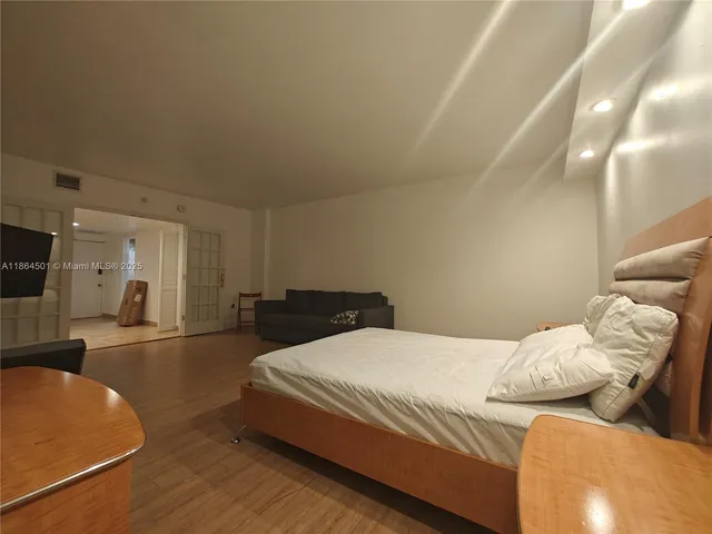 a kitchen with stainless steel appliances granite countertop a sink and a microwave