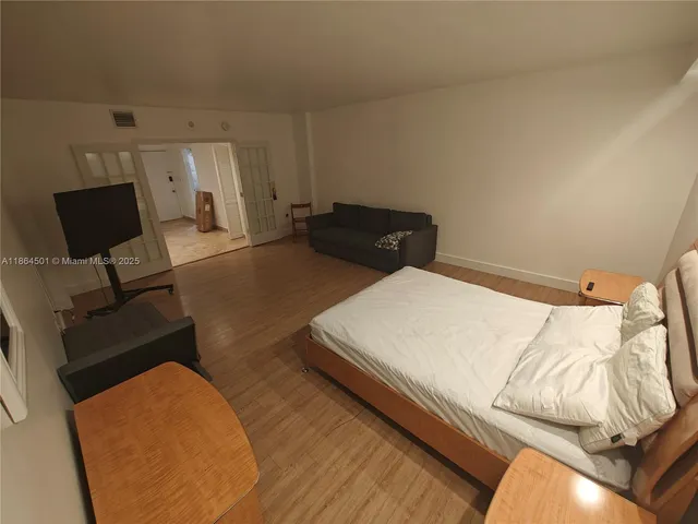 a kitchen with a refrigerator and a sink