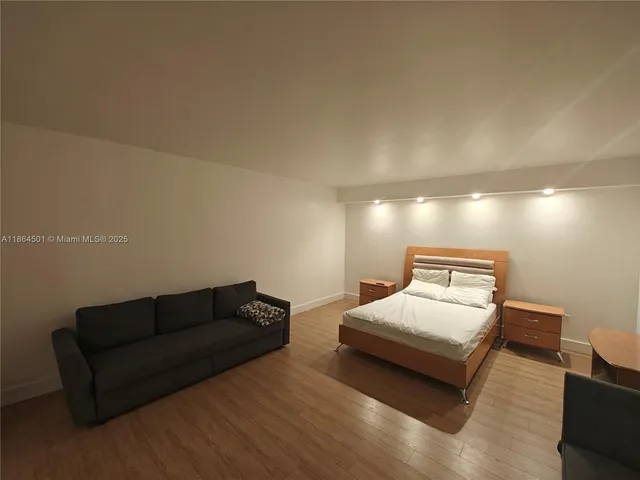 a view of a refrigerator in kitchen and a window