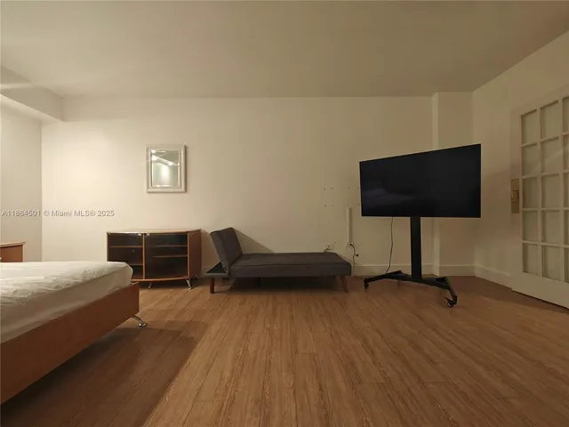 a view of a hallway with bathroom