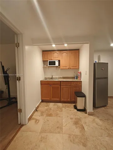 a view of a hallway with seating area