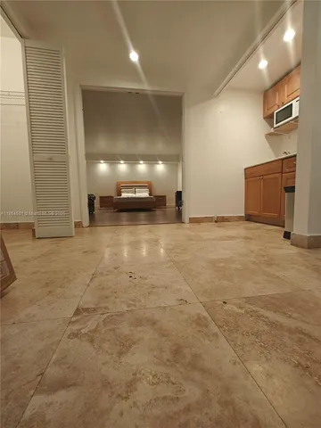 a view of a room with rack on the wall