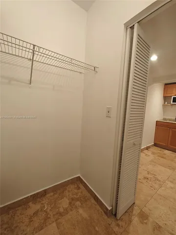a bathroom with a white bath tub and a shower