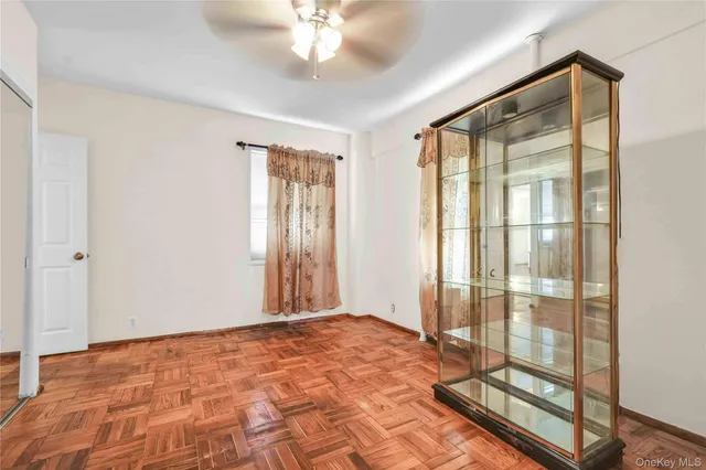 a view of an empty room with glass door