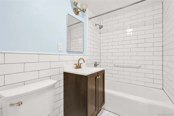a bathroom with a bathtub and sink