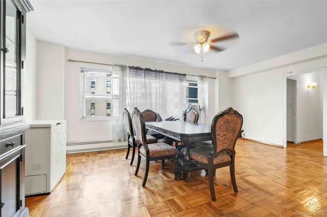 a view of a dining room with furniture and a chandelier
