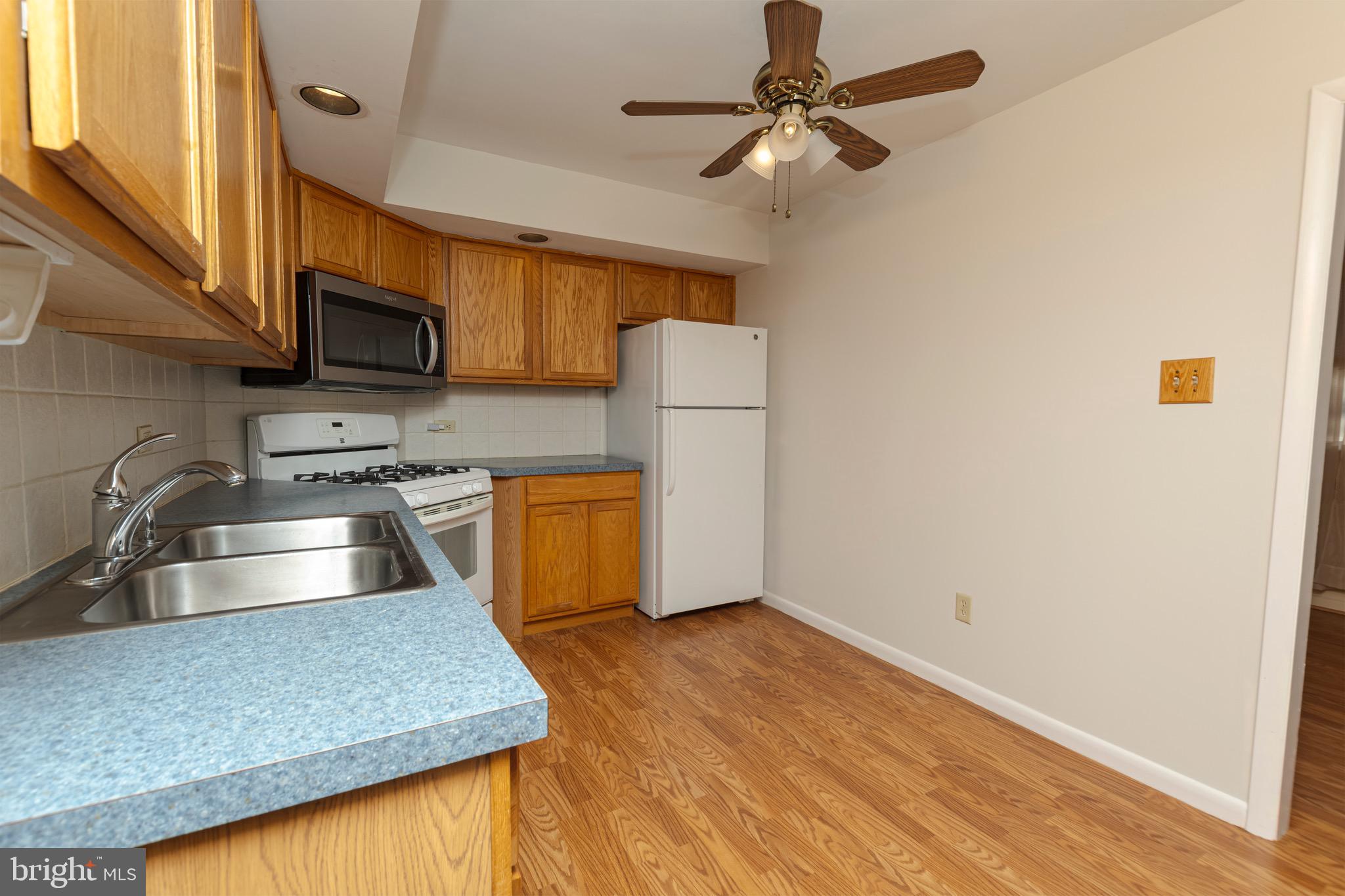 16 Pinedale Road Newark, DE 19711 - Photo 19 of 55 a kitchen with a sink a stove and cabinets