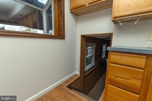 a view of an empty room with a fireplace