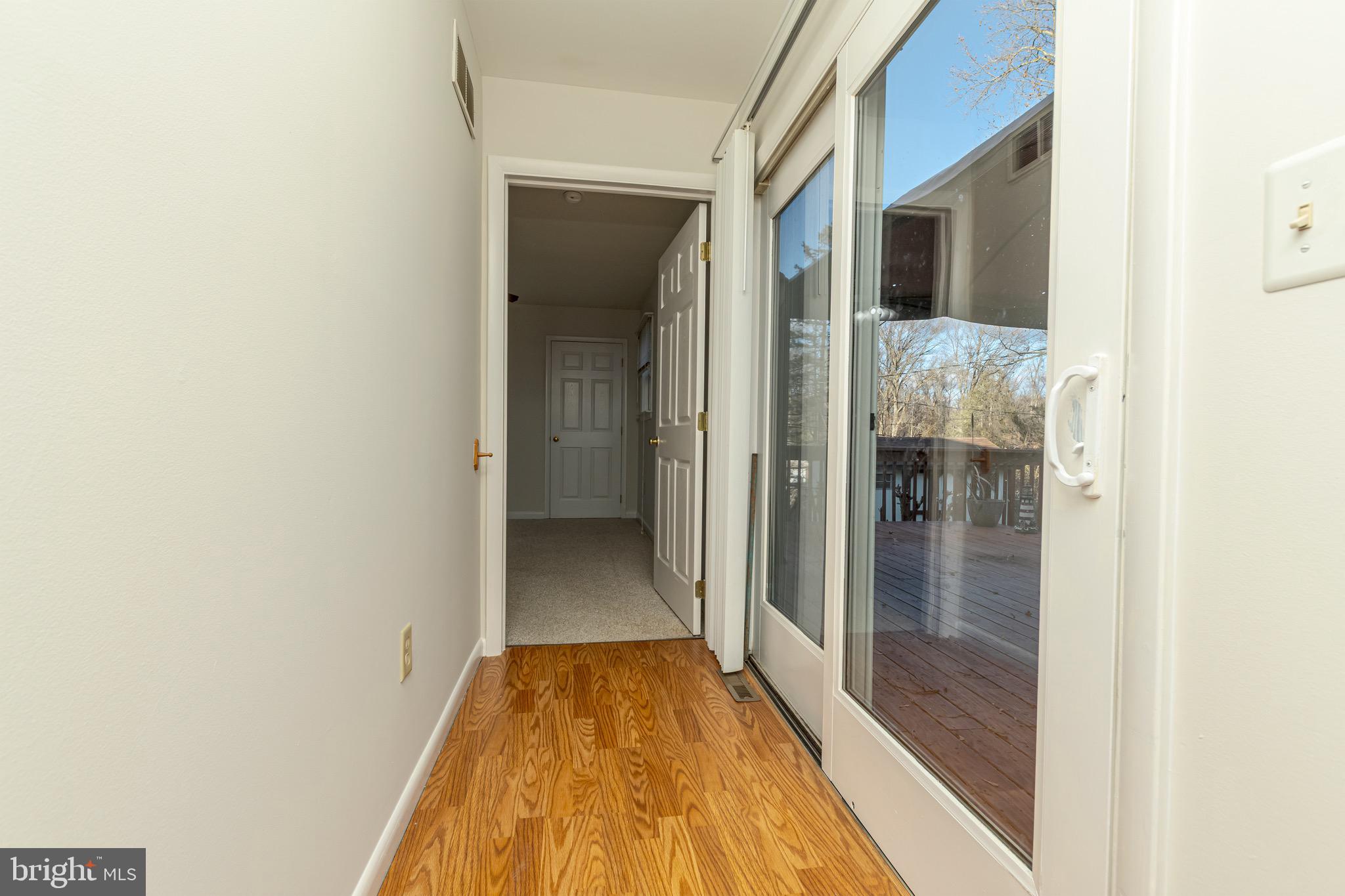 16 Pinedale Road Newark, DE 19711 - Photo 26 of 55 a view of a hallway with wooden floor and a bathroom