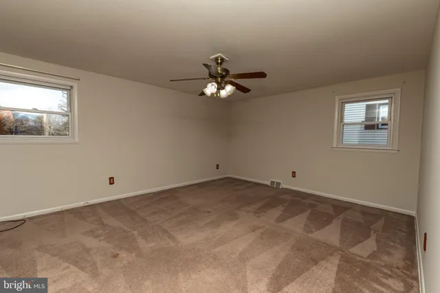 a view of a balcony with wooden floor