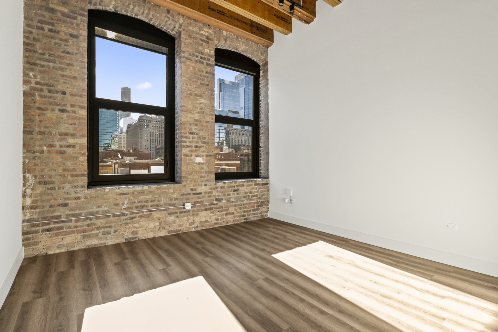 153 West Ohio Street, Unit 406 Chicago, IL 60654 - Photo 2 of 14 a view of wooden floor in a house
