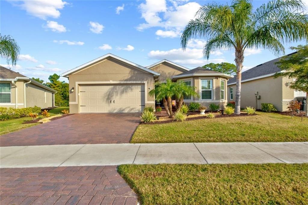 8973 Excelsior Loop Venice, FL 34293 - Photo 1 of 1 a front view of a house with a yard and garage