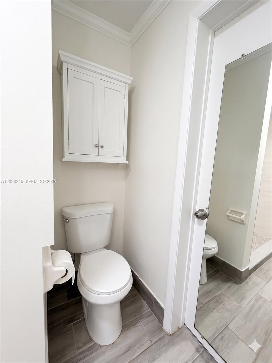 13 Southwest 3rd Street, Unit 13 Pompano Beach, FL 33060 - Photo 26 of 44 a bathroom with a toilet