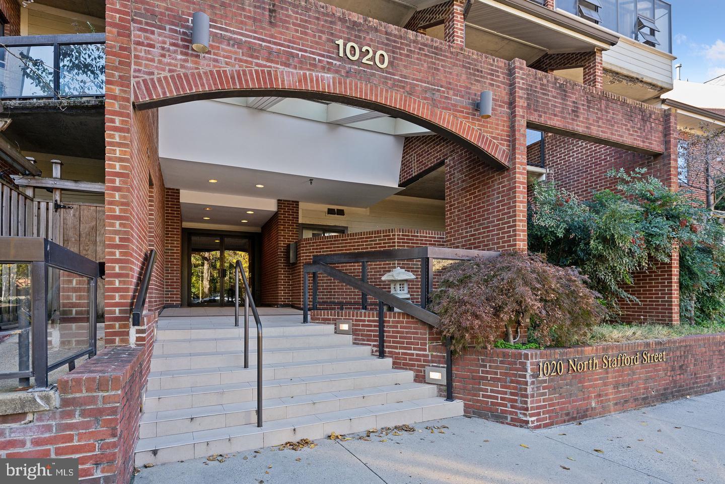 1020 North Stafford Street, Unit 311 Arlington, VA 22203 - Photo 1 of 37 a front view of a building with glass windows and door