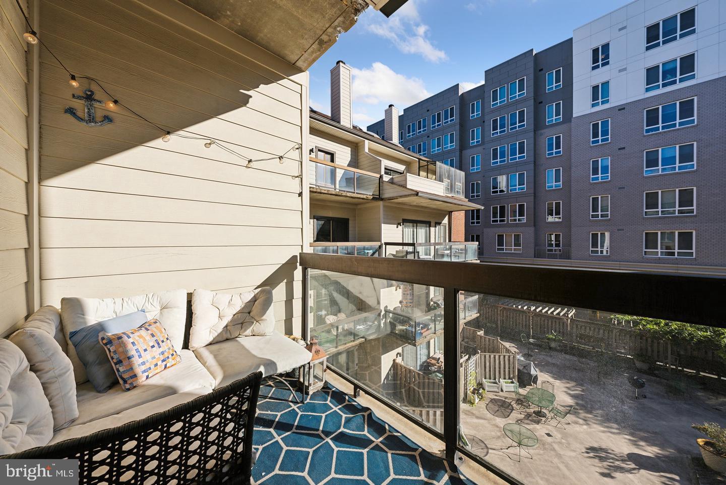1020 North Stafford Street, Unit 311 Arlington, VA 22203 - Photo 13 of 37 a balcony view with couple of chairs