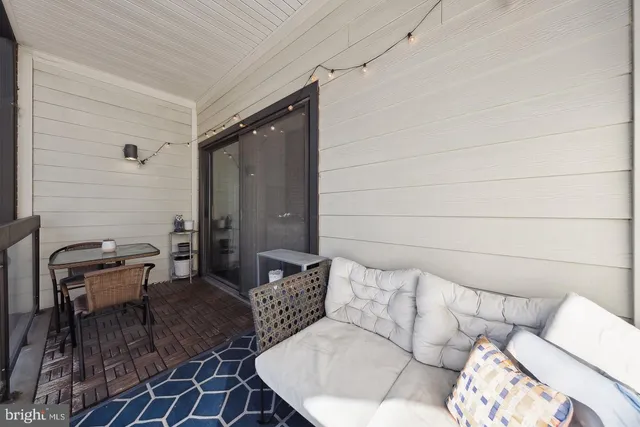 a living room with furniture and a rug