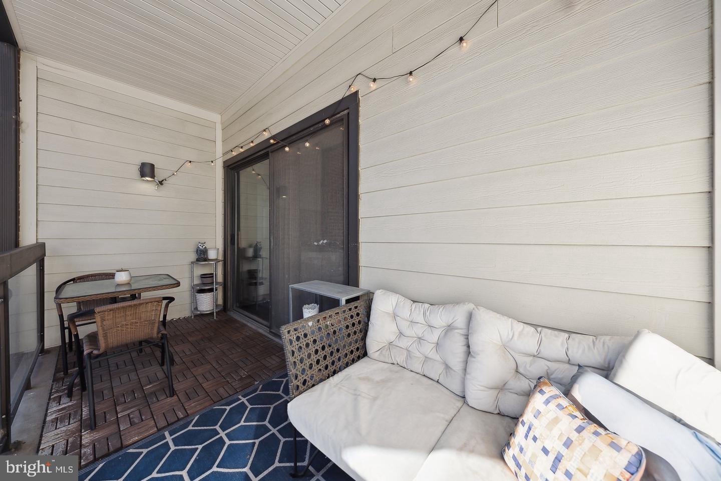 1020 North Stafford Street, Unit 311 Arlington, VA 22203 - Photo 14 of 37 a living room with furniture and a rug
