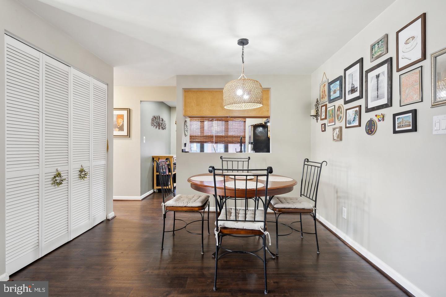 1020 North Stafford Street, Unit 311 Arlington, VA 22203 - Photo 16 of 37 a view of a dining room with furniture and wooden floor