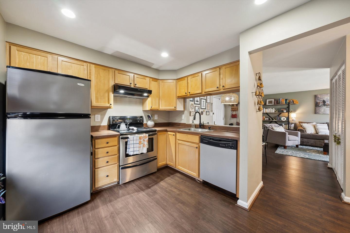 1020 North Stafford Street, Unit 311 Arlington, VA 22203 - Photo 20 of 37 a kitchen with stainless steel appliances a stove a sink and a refrigerator