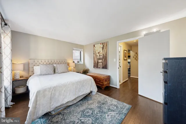 a bedroom with a large bed and a couch