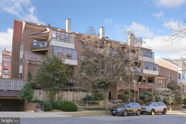 a view of a parked cars in front of a building
